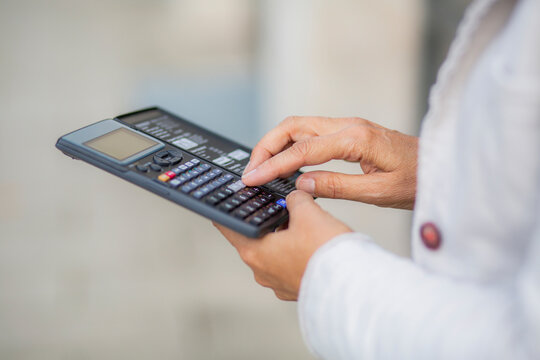 Businesswoman using calculator for accuracy