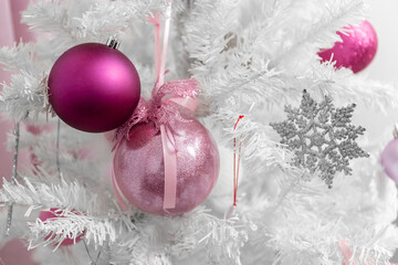 White Christmas tree. Decorative balls for the Christmas tree. Close-up.