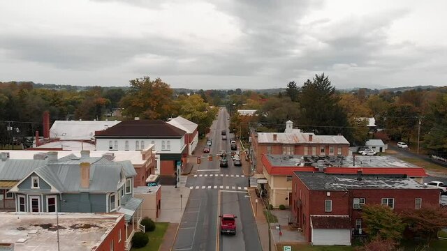 Aerial Down Main Street of Small Rural Town Autumn Fall Colorful