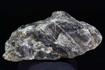 Plagioclase (feldspar) - unworked rock specimen on dark background close up. Russia
