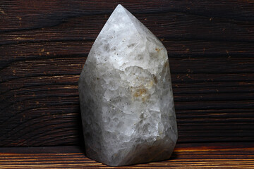 Vein icy quartz artificially processed into a crystal shape
