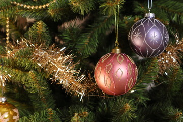 Christmas tree with two shiny toys