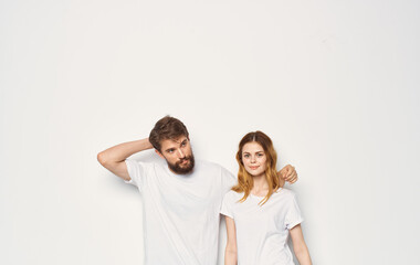 Fototapeta premium Man and woman stand next to t-shirts family casual wear lifestyle