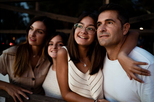Happy family looking away while spending leisure time during vacation