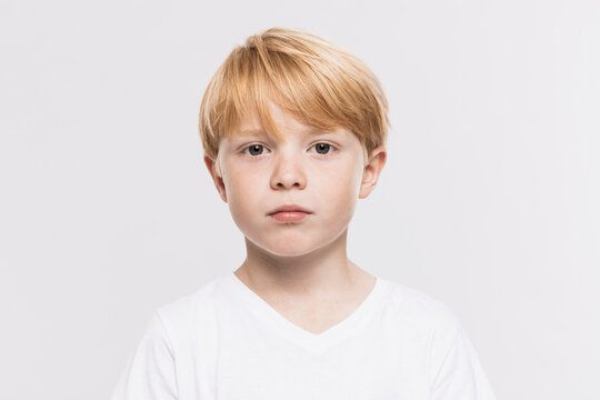 Cute boy in t-shirt against white background