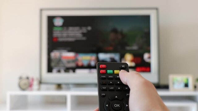 person watching tv online video streaming service. with apps and hand. smart tv. 
