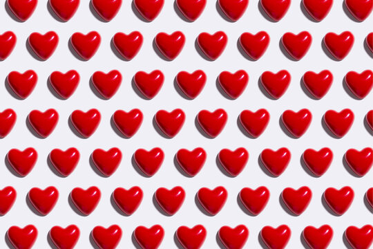 Pattern of red hearts against white background