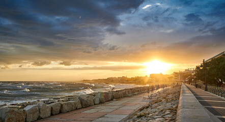 Sunset in Caorle seaside promenade in autumn