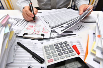 business concept - businessman working with reports in office, table and workspace close view,...