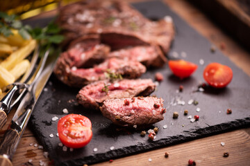 Sliced grilled medium rare beef steak