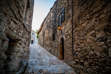 Old houses in the streets of the ancient village Lacoste in Provence, France