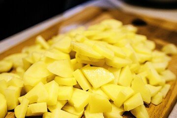 chopped potatoes on a cutting board with a close-up. Cooking. Vegan food.