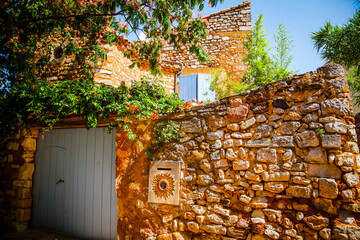 Colourful windows and houses in the ancient village of Roussilion in Provence, France