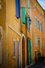 Colourful windows and houses in the ancient village of Roussilion in Provence, France