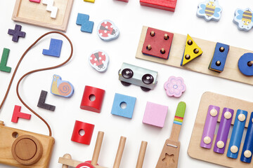 Colorful wooden children's eco friendly, sustainable toys, flat lay on white background