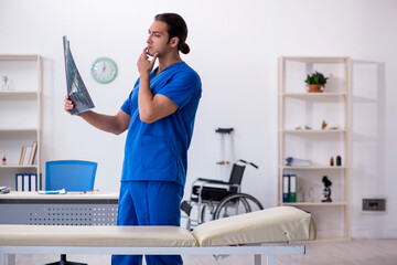Young male doctor radiologist working in the clinic