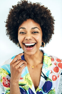 Cheerful black woman laughing brightly