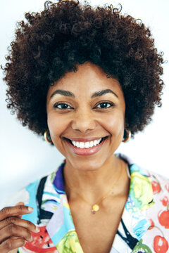 Sincere black woman laughing charmingly