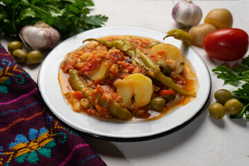 Mexican style cod called a la vizcaina on white background