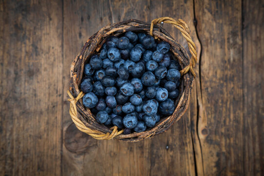 Wicker basket with fresh blueberries
