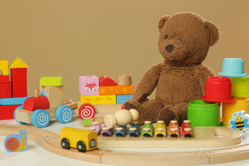 Colorful cildren's toys on table, wooden, plastic and plush toys