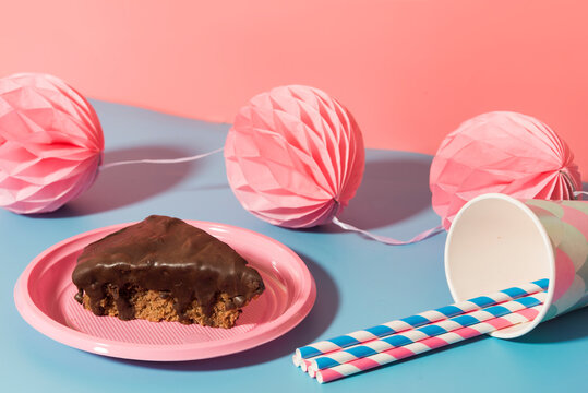 Chocolate cake, tissue paper&not;&dagger;pom-poms&not;&dagger;and paper cups and straws