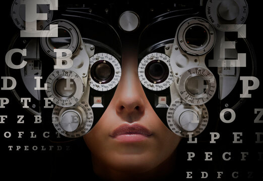 Woman looking through phoropter