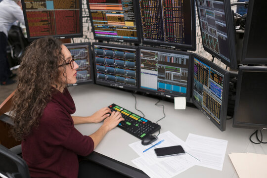 Young trader analyzing computer data