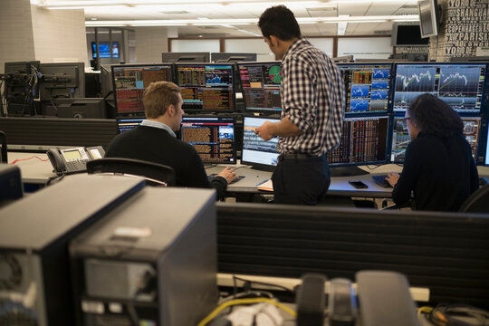 Young traders working in stock market