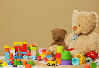 Colorful cildren's toys on table, wooden, plastic and plush toys