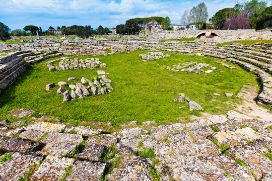 Rocks of Paestum ruins in circle on grass