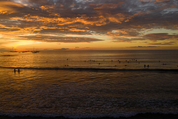 Obraz premium Ariel sunset of the surf in Tamarindo Costa Rica.