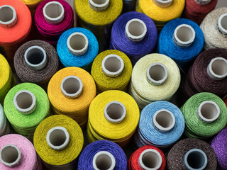 Multicolored threads, Rows of spools for sewing machine and embroidery