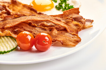 Fried Bacon with eggs, american breakfast