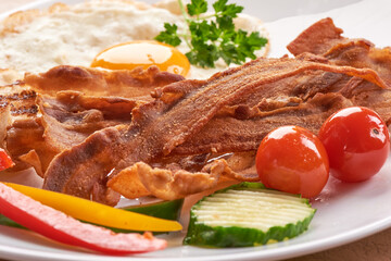 Fried Bacon with eggs, american breakfast