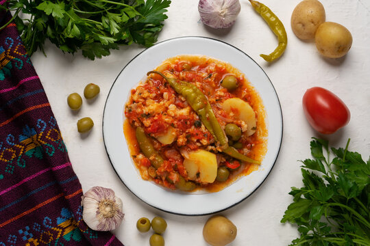 Mexican style cod called a la vizcaina on white background