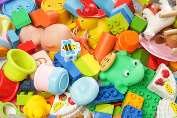 Fototapeta na wymiar Pile of various colorful children's toys. 