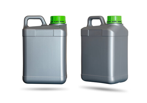 Gray plastic jerrycan with green lid standing sideways and diagonally on white background