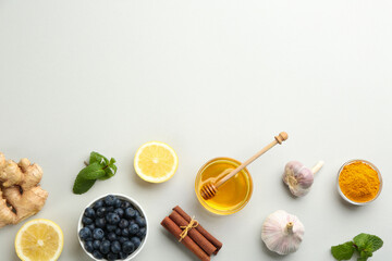 Flat lay composition with fresh products on grey background, space for text. Natural antibiotics