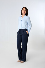 Full length portrait of mature businesswoman on white background