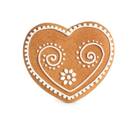 Gingerbread heart decorated with icing isolated on white