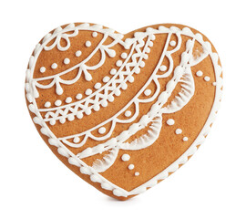 Gingerbread heart decorated with icing isolated on white