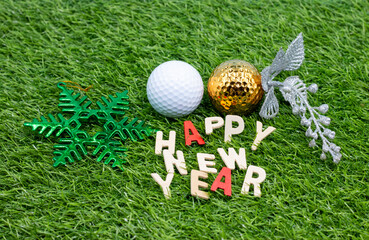Naklejka premium Golf Happy Ne Year with golf ball and word on green grass