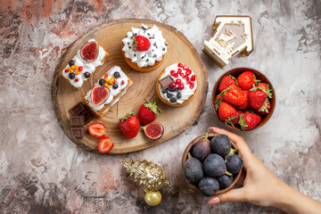 top view delicious cakes with fresh fruits on light background biscuit christmas cake dessert color