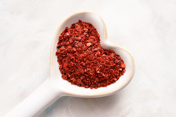 Dried Aleppo Peppers in a Heart Shaped Spoon