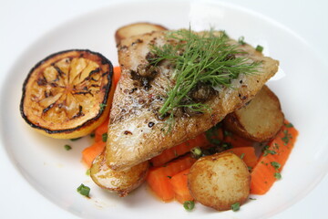 Pan fried barramundi with sweet carrots and fried potatoes