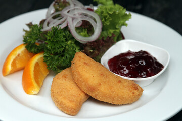 Baked Camembert with cranberries and salad garnish