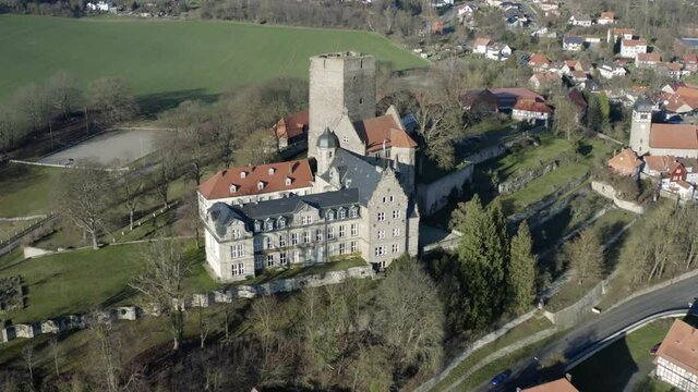 Drone aerial view of the fairytale castle Adelebsen on a beautiful autmn afternoon in golden sunlight. Adelebsen is a historic medieval town Flecken near G&ouml;ttingen in Niedersachsen, Germany.