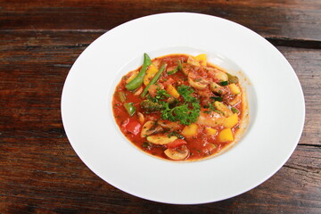 Vegetable stew on white plate