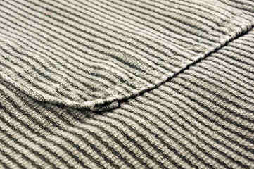 clothing items stonewashed cotton fabric texture with seams, clasps, buttons and rivets, macro